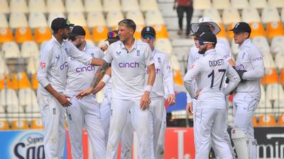 England bowler Brydon Carse, centre, celebrates with teammates after dismissing Pakistan's Aamer Jamal. Carse finished with 2-74 on his debut. EPA