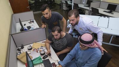 From top left: Ahmed Hamdan, Mohammed Atfa, Abdulrahman Azam and Mohammed Nofal, fourth-year electrical engineering students at Ajman University of Science and Technology, have designed a smart bed for the bedridden. Antonie Robertson / The National