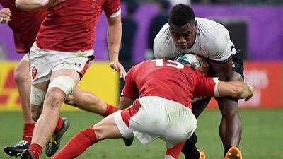 Fiji's wing Josua Tuisova (R) is tackled by Wales' full back Liam Williams during the Japan 2019 Rugby World Cup Pool D match between Wales and Fiji at the Oita Stadium in Oita. AFP