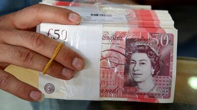 The average UK worker would have to live a very long time to earn the same amount as executives earn in a year. Yasser Al Zayyat / AFP