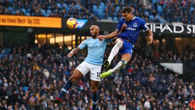 Dominic Calvert-Lewin of Everton scores his team's first goal as he is challenged by Fabian Delph of Manchester City. Getty Images