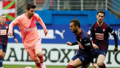 Eibar's Joan Jordan, right, in action against Messi. EPA
