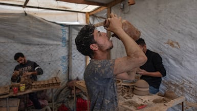 Palestinian potters at work in Al Zawaida, central Gaza Strip, as the fragile ceasefire between Israel and Hamas continues. EPA