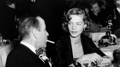 Humphrey Bogart, left, and his wife, actress Lauren Bacall, appear at the Stork Club in New York. AP