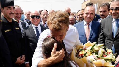 French President Emmanuel Macron is welcomed upon his arrival at the Al-Nuri Mosque in Iraq's second city of Mosul. AFP