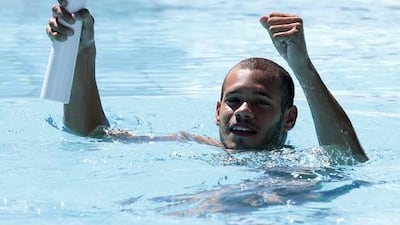The Icarus Pereira swimmer takes the Olympic torch, while swimming in the pool water complex in Brasilia, Brazil. The Olympic torch will pass through 329 cities in Brazil, before arriving in Rio de Janeiro on August 5, for the lighting of the cauldron. Igo Estrela / Getty Images