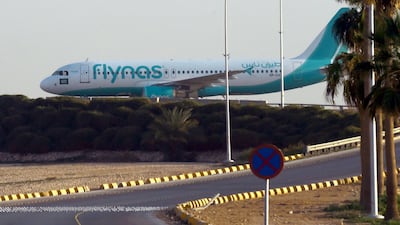 A flynas plane taxies on the tarmac at the King Khalid International Airport in Riyadh. The Kingdom's low-cost carrier signed an $8.6 billion deal with Airbus to purchase 80 A320neo single-isle jets. fayez Nureldine / AFP