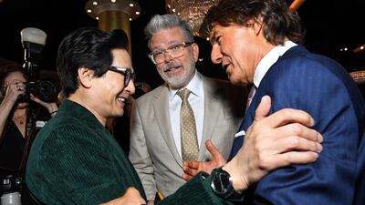 From left, actor Ke Huy Quan and filmmaker Christopher McQuarrie with Cruise. AFP