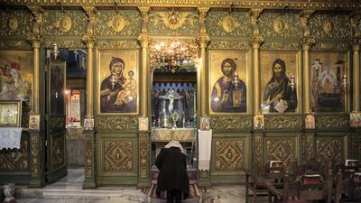 Members of Greek Orthodox Christian community arrive for Sunday mass at the Church of Saint Porphyrius.