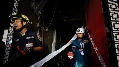 Thai rescue workers search for victims. EPA