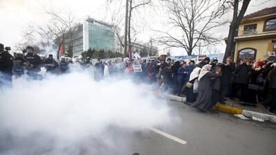 Turkish riot police use tear gas to disperse protesting employees and supporters of Zaman outside the newspaper’s office in Istanbul on March 5, 2016. Osman Orsal / Reuters