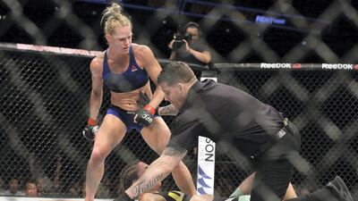 The referee stops the fight between Holm and Bethe Correia of Brazil at UFC Singapore Fight Night in 2017. Getty