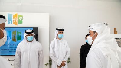 Sheikh Hazza, right, inspects Khalifa Social Square, the new community arena.