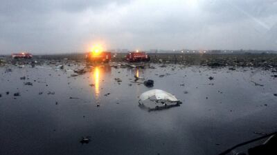 In this photo provided by vk.com/rostovnadonu, Russian emergency lorries are seen among the wreckage of a crashed plane at the Rostov-on-Don airport. vk.com/rostovnadonu group via AP