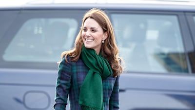 The Duchess of Cambridge wears a McQ Black Watch tartan coat as she arrives at the opening of the V&A Dundee Design Museum, in Scotland on January 29. The coatdress is accessorised with a green Pickett London scarf, a Manu Atelier bag, Tod pumps and Cornelia James gloves. EPA