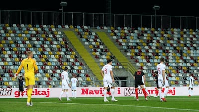 General view of empty stands during the match. Reuters