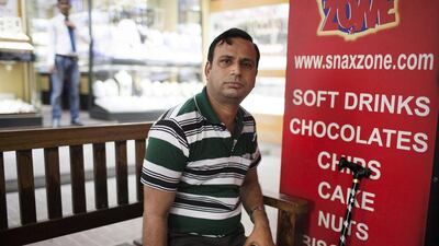 Kolkata native Wasim Khan earns Dh1,200 a month as a salesman in Dubai and needs a prosthetic leg to keep working so he can support his five children. Anna Nielsen for The National