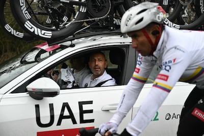 UAE Team Emirates-XRG sports manager Matxin Joxean Fernandez speaks to rider Jhonatan Narvaez during the 2025 Milan-Sanremo race. AFP