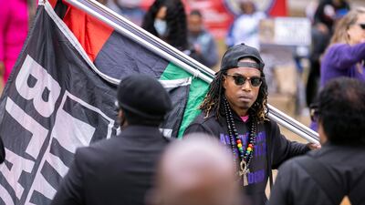Black Lives Matter and Black Panther protesters gather in Brunswick, Georgia, last November during the trial of three men charged with the slaying of Ahmaud Arbery. AP Photo