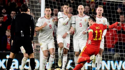 Wales attacker Gareth Bale goes for goal from a free-kick. Reuters