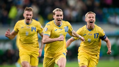 Mykhailo Mudryk of Ukraine, centre, celebrates scoring his team's winning goal during the Uefa Euro 2024 play-off victory over Iceland. Getty Images