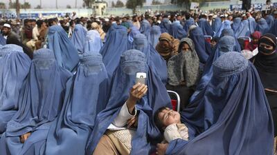 Supporters of Afghan presidential candidate Abdullah Abdullah listen to his speech on February 18, 2014, during a campaign rally in Jalalabad, Afghanistan. Eleven candidates are in the running for the election scheduled for April, 2014. Rahmat Gul / AP photo