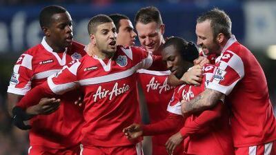 Qpr's Shaun Wright Phillips, second right, with team mates after his winner against former club Chelsea last night. Ian Walton / Getty Images