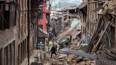A man walks through rubble in Bhaktapur near Kathmandu. Menahem Kahana / AFP