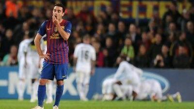 Xavi Hernandez looks dejected Barcelona lose to Chelsea in the Champions League semi-final. Barca players were over-worked due to poor scheduling. Lluis Gene / AFP