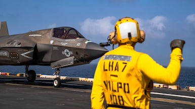 A US fighter jet prepares to take off from the USS Tripoli on Friday. Photo: Centcom
