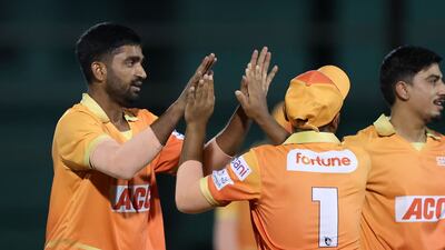 Giants' Muhammad Irfan takes the wicket of Pearls' Asif Khan.