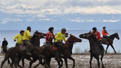 Kyrgyz riders play the traditional Central Asian sport of Kok boru or Buzkashi, marking the first day of Iranian New Year. AFP