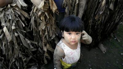 The women and children prayed to Saint John the Baptist to spare them, and suddenly there was a rainstorm, causing the soldiers and their captives to scatter, the village’s barangay captain, Norberto Eugenio says. Bullit Marquez / AP Photo