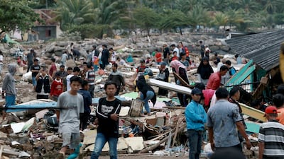 Rescuers and residents look for survivors along the coast in South Lampung on South Sumatra. AFP