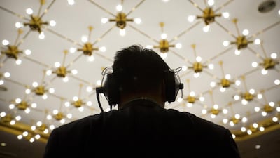 A Chinese camera operator records a press conference by Xu Shaoshi, director of China’s National Development and Reform Commission, in Beijing. Mark Schiefelbein / AP Photo