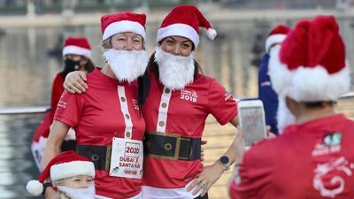 A picture perfect moment for a trio of Santas