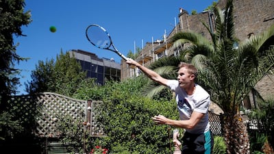 British tennis player Dominic Inglot during a training session in his garden in Chiswick. Reuters