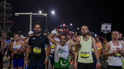 Participants warm up in the early hours.