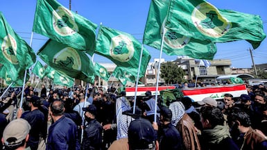Mourners attend a funeral for members of Iraq's Popular Mobilisation Forces. The US and Israel have attacked bases used by pro-Tehran groups across Iraq. AFP