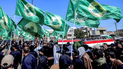 Mourners attend a funeral for members of Iraq's Popular Mobilisation Forces. The US and Israel have attacked bases used by pro-Tehran groups across Iraq. AFP