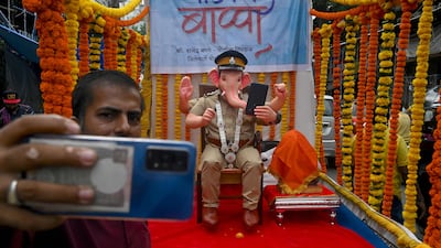 A passer-by takes a selfie in Mumbai. AFP
