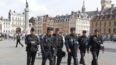 French police patrol a square in downtown Lille ahead of the Euro 2016 Group B match between Russia and Slovaki. Darko Bandic / AP Photo