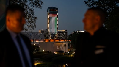 The UAE flag is displayed on a building during the dinner reception at Marina Belgrade Waterfront