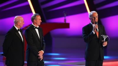 Franz Beckenbauer, right, accepts the Laureus Lifetime Achievement Award from fellow greats Sir Bobby Charlton, left, and Johan Cruyff. Getty Images