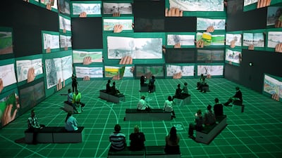 An immersive digital art exhibit, called Bigger and Closer (Not Smaller and Further Away), which takes visitors through 60 years of artist David Hockney's work, in Sydney. EPA