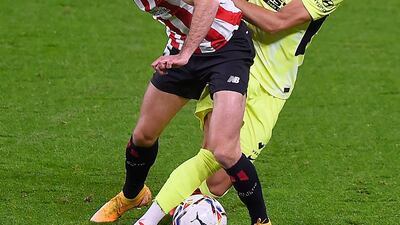 Athletic Bilbao's Spanish defender Inigo Lekue vies with Atletico Madrid's Belgian midfielder Yannick Carrasco. AFP