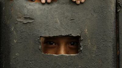 A Filipino boy holds on a dyke at an on-going flood control project in Paranaque city, south of Manila, Philippines. State weather bureau Philippine Atmospheric, Geophysical and Astronomical Services Administration warned residents in low lying areas of possible flash floods and landslides. Francis R Malasig / EPA