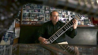 Sanjay Sharma is a third-generation instrument maker. Kevin Frayer / AP Photo