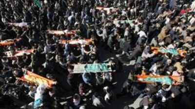A funeral procession for the victims of an Israeli strike on a UN school in Gaza City makes its way through the streets.