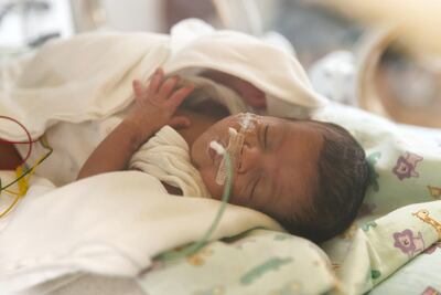 Dahm, weighing 1kg at birth, survived but his brother, named Dahoon, who weighed just 600g, did not. Reem Mohammed / The National